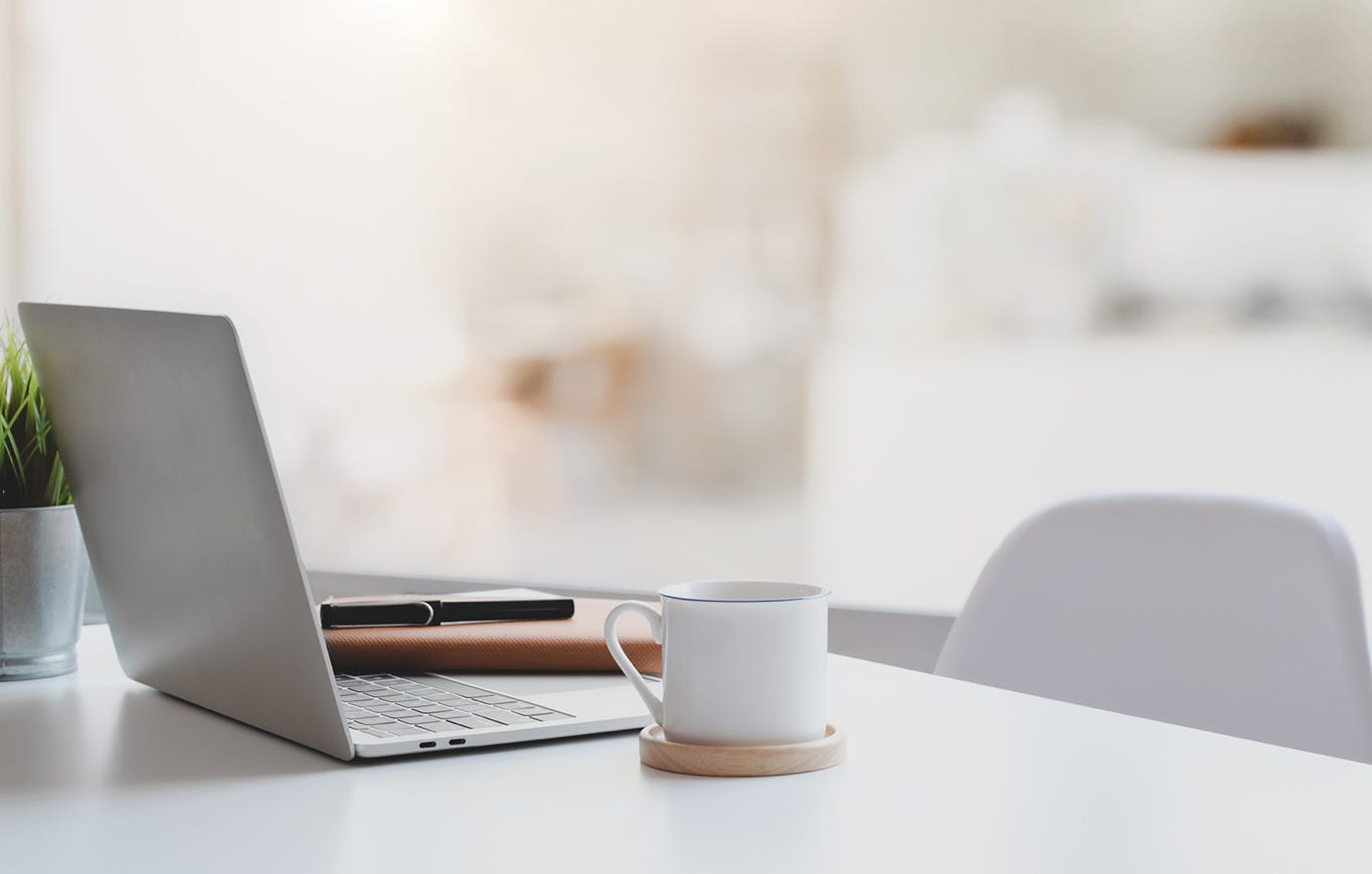 Desk With Laptop By Window